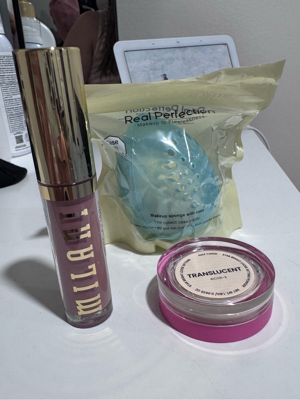 Milani Liquid Lipstick, Translucent Setting Powder and makeup Sponge with case